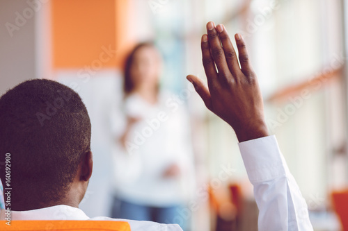 Canvas Print African american Business people Raising there Hand Up at a Conference to answer