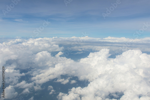 Fototapeta Naklejka Na Ścianę i Meble -  Blue sky and Clouds as seen through window of aircraft