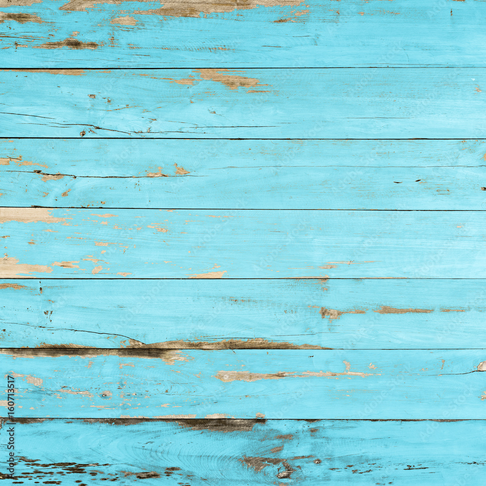 Fototapeta premium Vintage blue wood texture background with peeling paint.