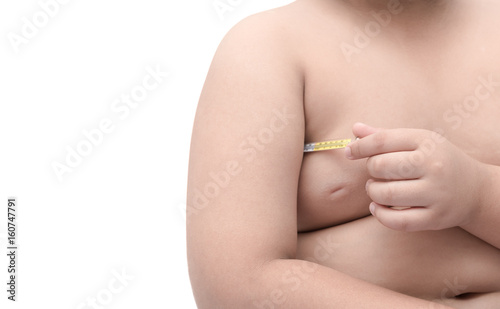 obese fat boy put medical thermometer to an armpit