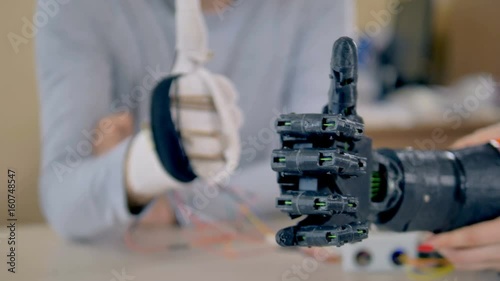 Precise moves of bionic arm repeating moves of a real arm. 4K.