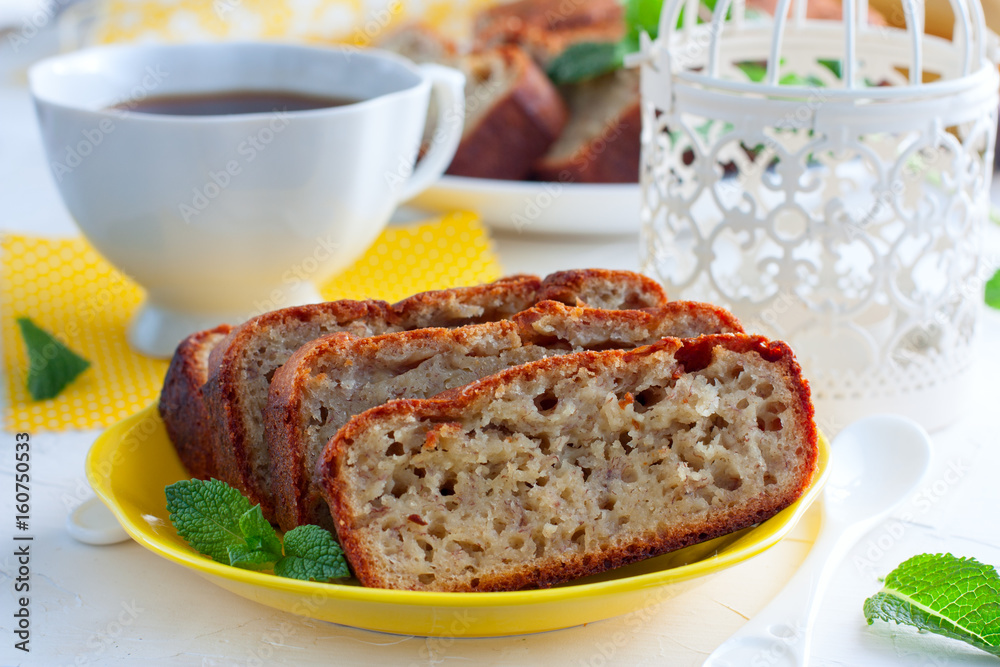 Homemade banana bread sliced on a table close-up. horizontal, rustic style Homemade banana bread sliced on a table close-up. horizontal, rustic style