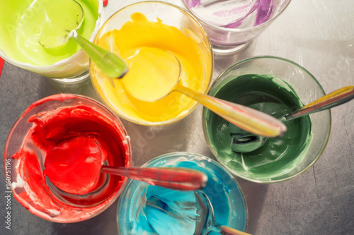 Glasses of various food coloring