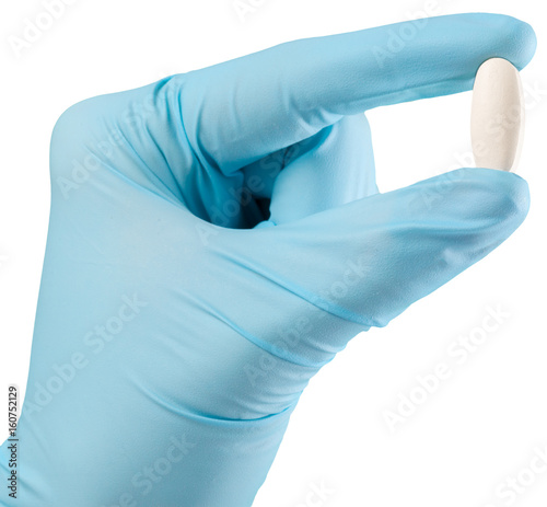 Gloved hand with a medicine
