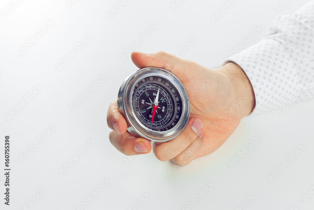 Businessman with a compass holding in hand Businessman with a compass holding in hand