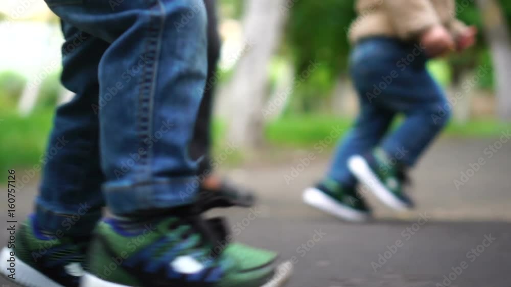 Pair of baby running in the park. Happy childhood concept. Slow motion Pair of baby running in the park. Happy childhood concept. Slow motion