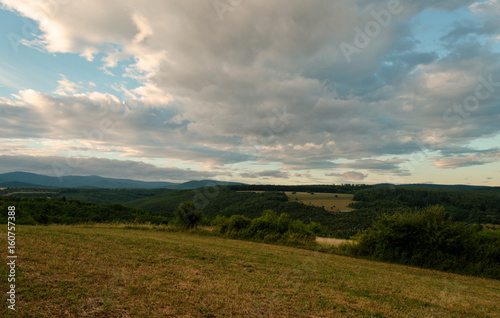 Cloudy sunny landscape scene in nature in the summer while hiking 