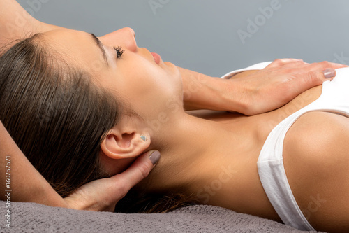 Detail of woman receiving physical neck therapy.
