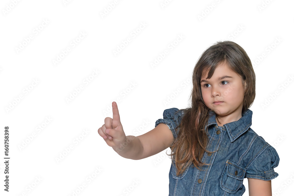 Little girl with a serious expression on her face is pointing index finger into space upwards. All is isolated on the white background. Little girl with a serious expression on her face is pointing index finger into space upwards. All is isolated on the white background.