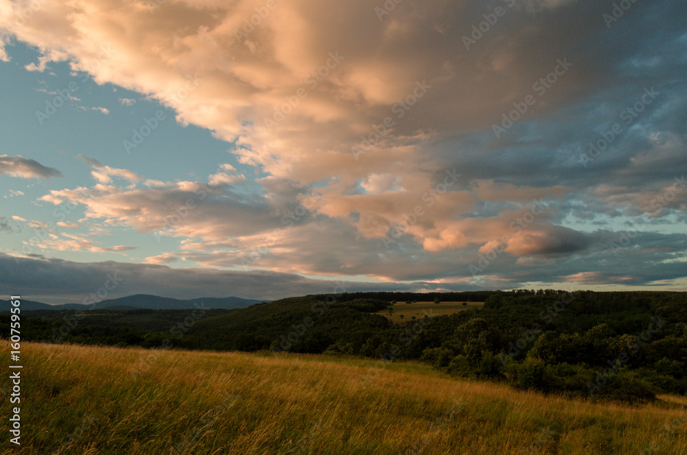 Cloudy sunny landscape scene in nature in the summer while hiking Cloudy sunny landscape scene in nature in the summer while hiking