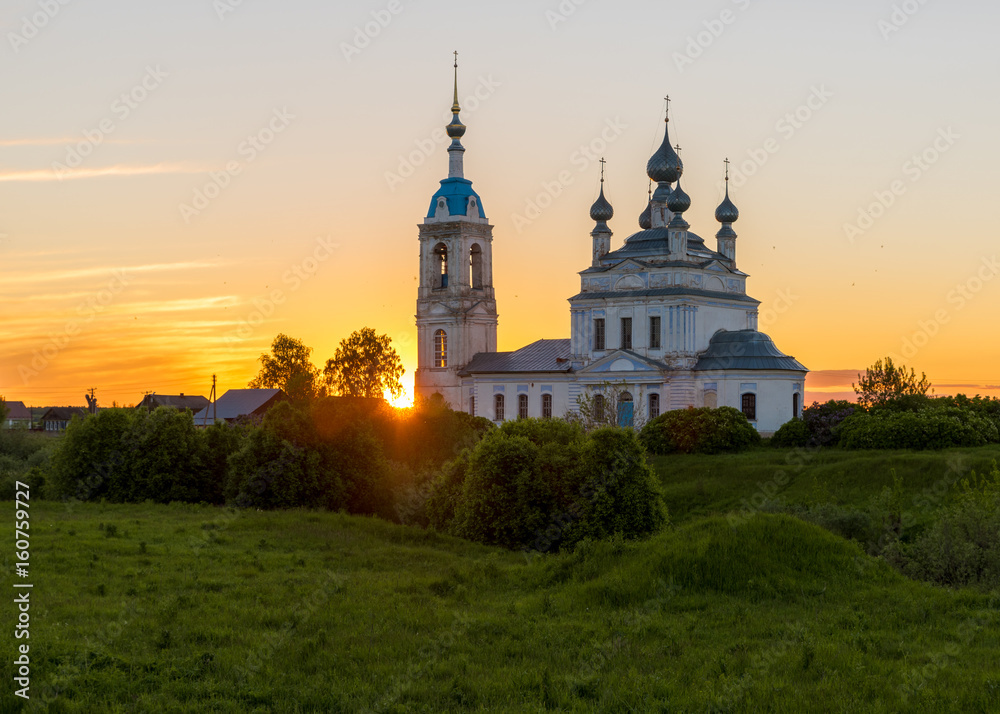 Sunset in the village Savinskoye, Yaroslavl region. Russia. The Church Of The Nativity Of The Blessed Virgin.