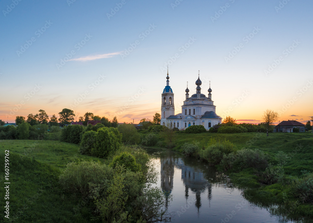 Sunset in the village Savinskoye, Yaroslavl region. Russia. The Church Of The Nativity Of The Blessed Virgin.