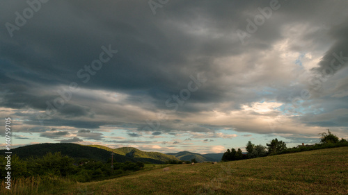 Cloudy sunny landscape scene in nature in the summer while hiking 
