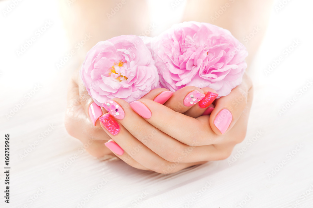 pink manicure with tea rose flowers. spa