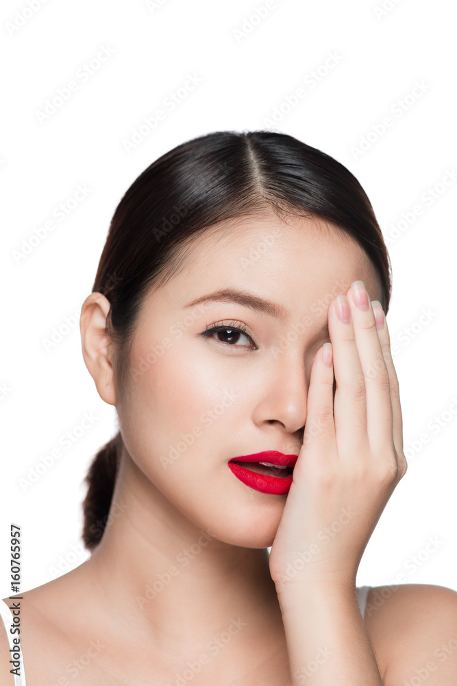Beautiful asian woman with retro makeup with red lips isolated on white background.