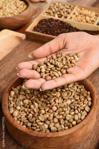 Freshly coffee beans on hand for background