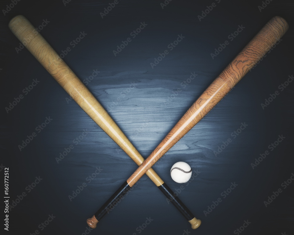 Baseball equipment on dark wooden surface Baseball equipment on dark wooden surface