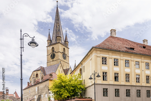 The bell tower of the Lutheran Cathedral of Saint Mary in Sibiu, Romania, dominates the historic center of the city