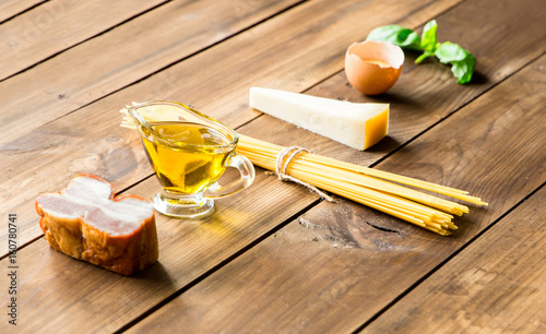 Italian carbonara ingredients on wooden background