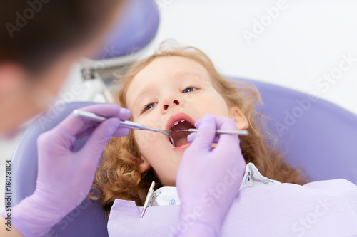 Close-up little girl at dentist