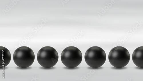 Line of black spheres