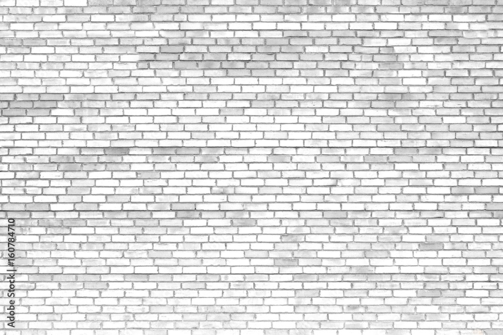 Old brick wall, the white surface of the stone blocks