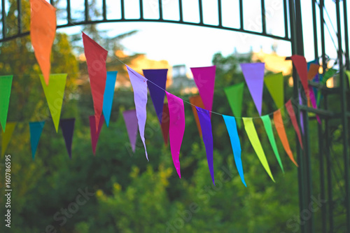 Colorful birthday flags hanging in the backyard