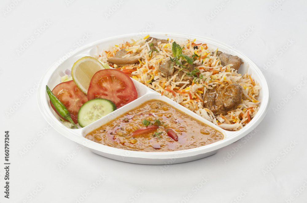 Indian meal combo with Chicken biryani and daal mash in disposable plate Indian meal combo with Chicken biryani and daal mash in disposable plate