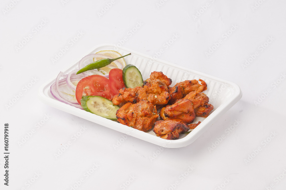 Boneless chicken tikka with mint dip and fresh salad Boneless chicken tikka with mint dip and fresh salad