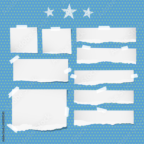 White ripped notebook, copybook sheets, stars stuck with sticky tape on blue dotted pattern.