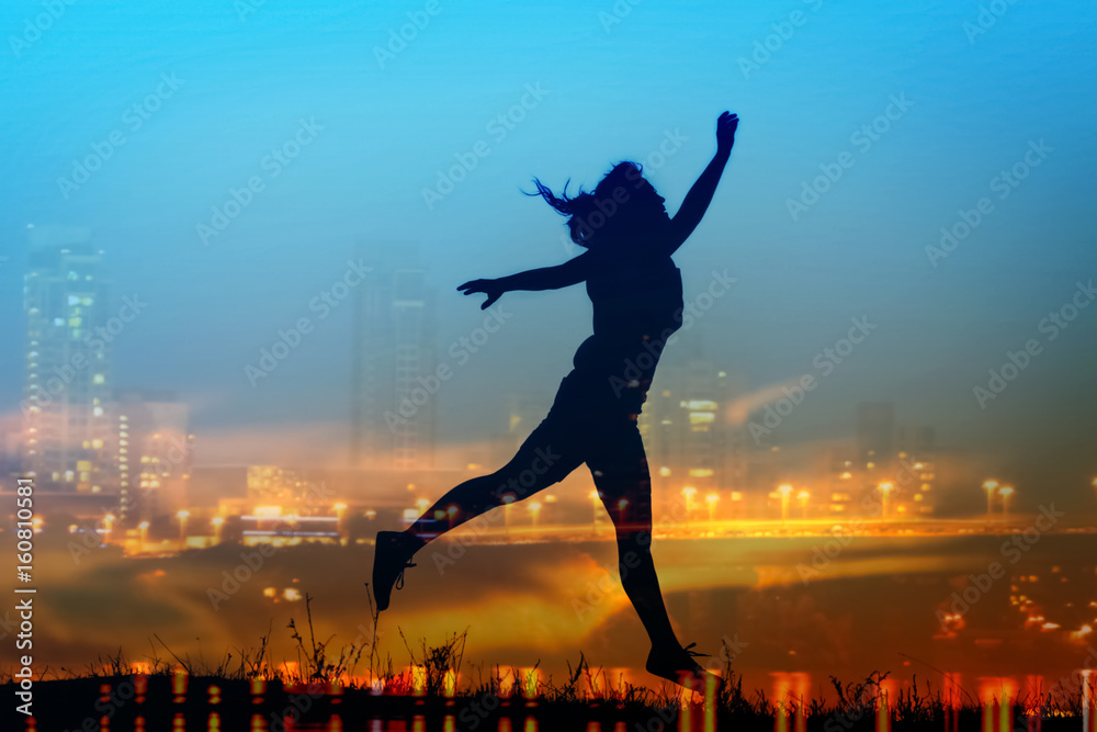 Silhouette of jumping woman on sunset sky background Silhouette of jumping woman on sunset sky background