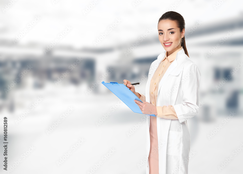 Young woman pharmacist with clipboard on white background Young woman pharmacist with clipboard on white background