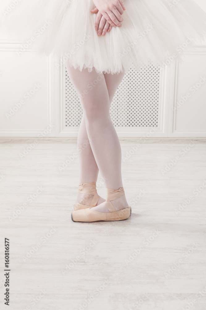 Ballerina legs closeup in fifth position Ballerina legs closeup in fifth position