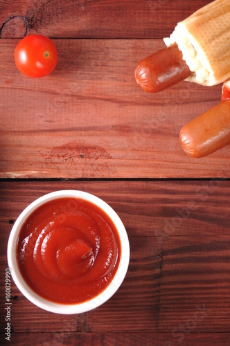 Two hot dogs with ketchup