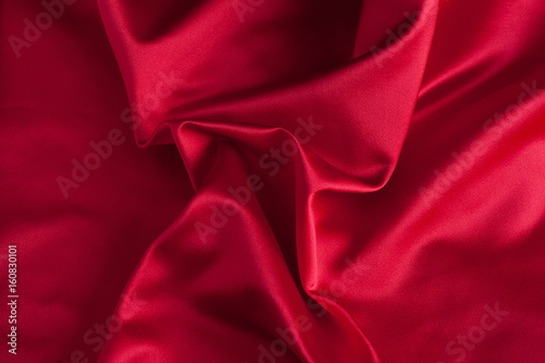 Folds of red silk fabric
