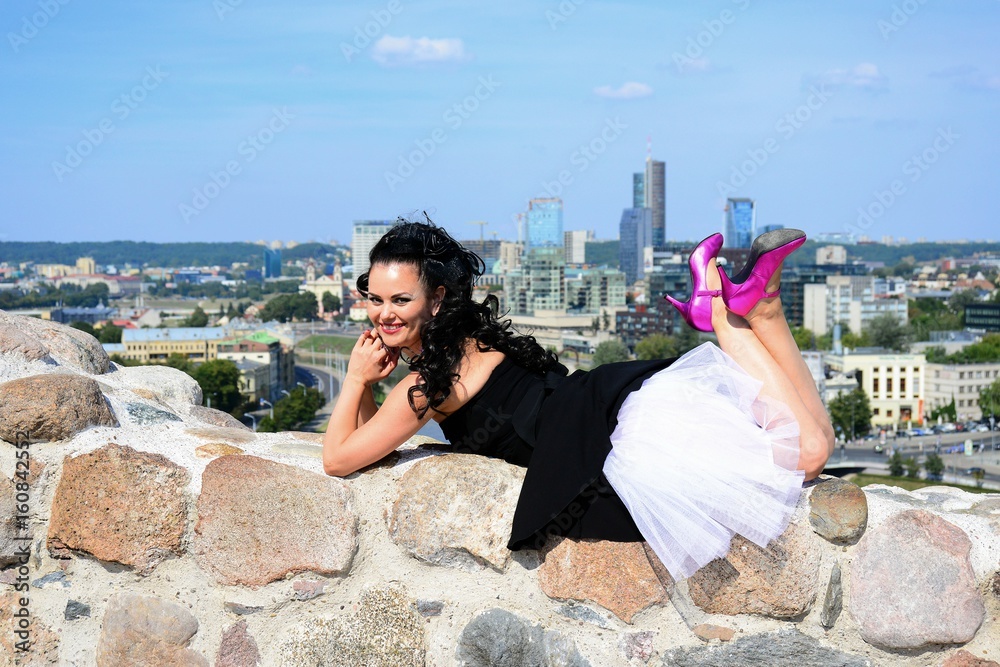 Beautiful girl in Vilnius town on Gediminas castle hill