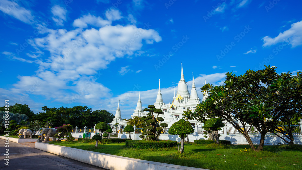 A large, elaborate white Buddhist Pagoda with multiple spires at Wat Asokara Temple in Thailand A large, elaborate white Buddhist Pagoda with multiple spires at Wat Asokara Temple in Thailand