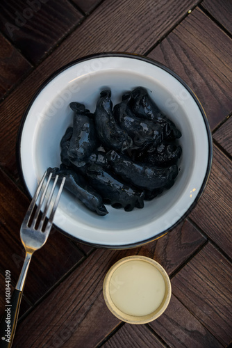 Black Russian dumplings vareniki in bowl photo