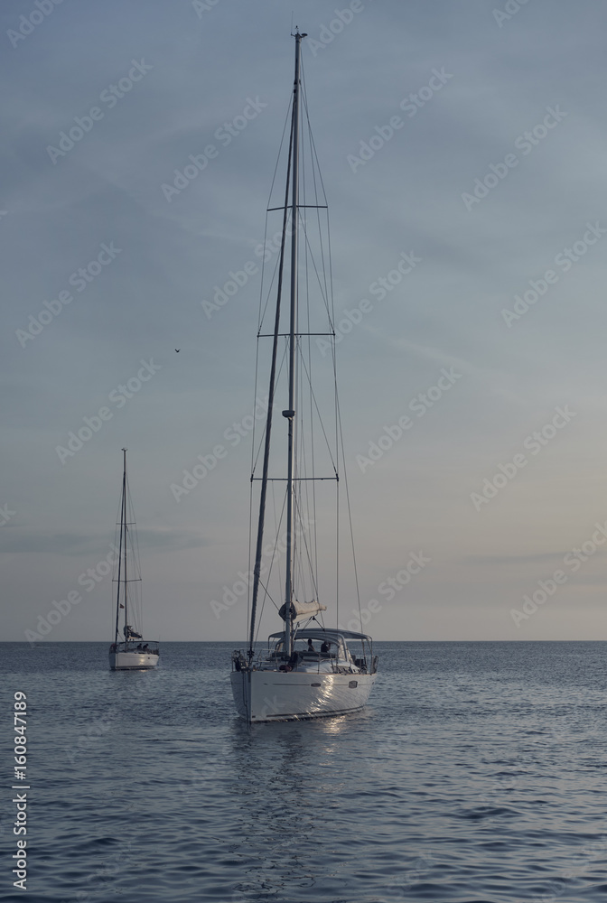 Yacht at Cala Saona in Formentera at sunset. Spain