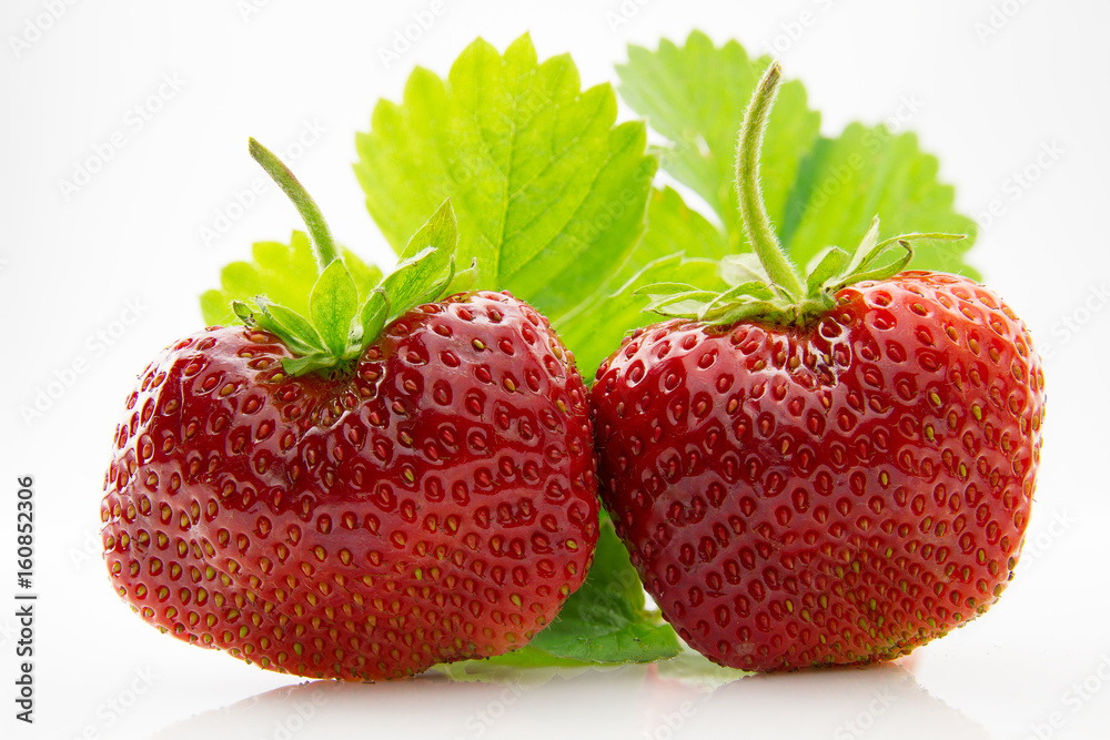 Fresh, ripe, juicy and mouth-watering strawberries with green leaves Fresh, ripe, juicy and mouth-watering strawberries with green leaves