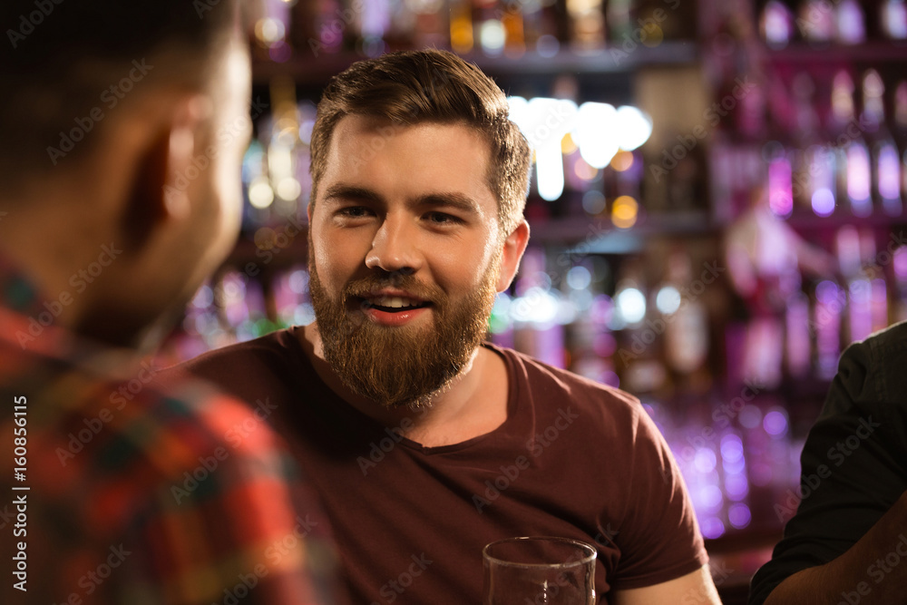 Close up of a two male friends drinking draft beer Close up of a two male friends drinking draft beer