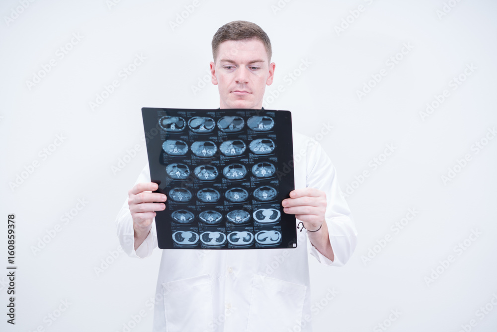 caucasian doctor holding ct scan film caucasian doctor holding ct scan film