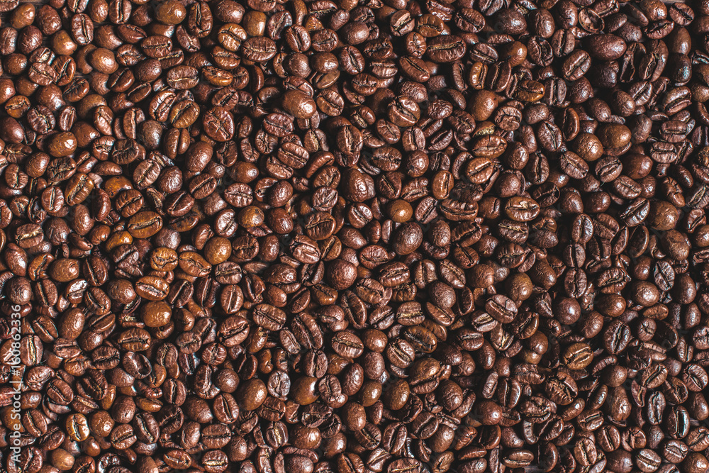 close up of heap of roasted aromatic brown coffee beans close up of heap of roasted aromatic brown coffee beans
