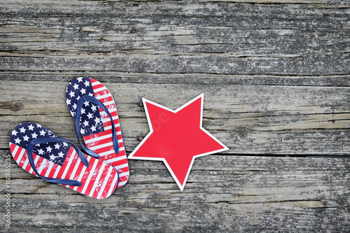 American themed flip flops on wood dock