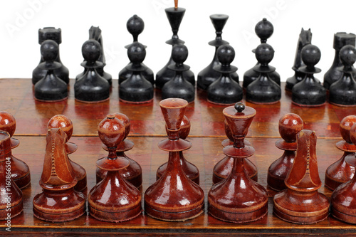 Chess pieces and board on a white background