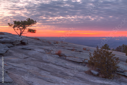 The beautiful view of the mountainside of Stone Mountain with pine tree and red horizon at sunset  Georgia  USA