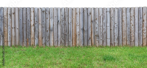  grassy hill with  a wooden fence