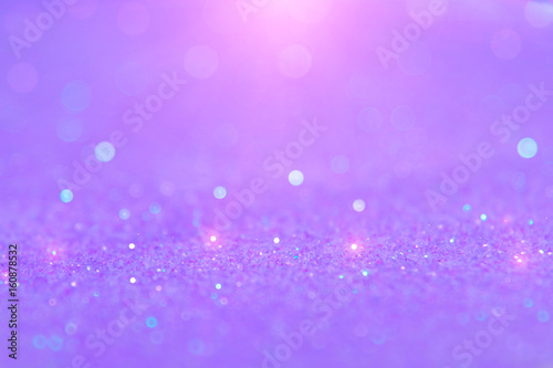 Soft violet or purple bokeh light is the soft blurred circles of light white and light purple . Winter Christmas and valentine background  wallpaper concept