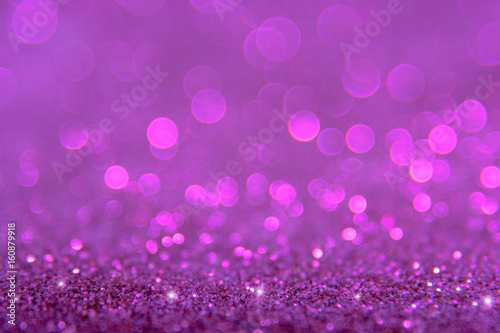 Violet or purple bokeh light is the soft blurred circles of light white and light purple . Winter Christmas and valentine background wallpaper concept
