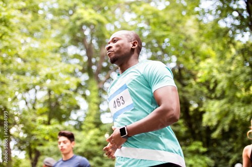 Young fit afro-american man crossing the finish line.